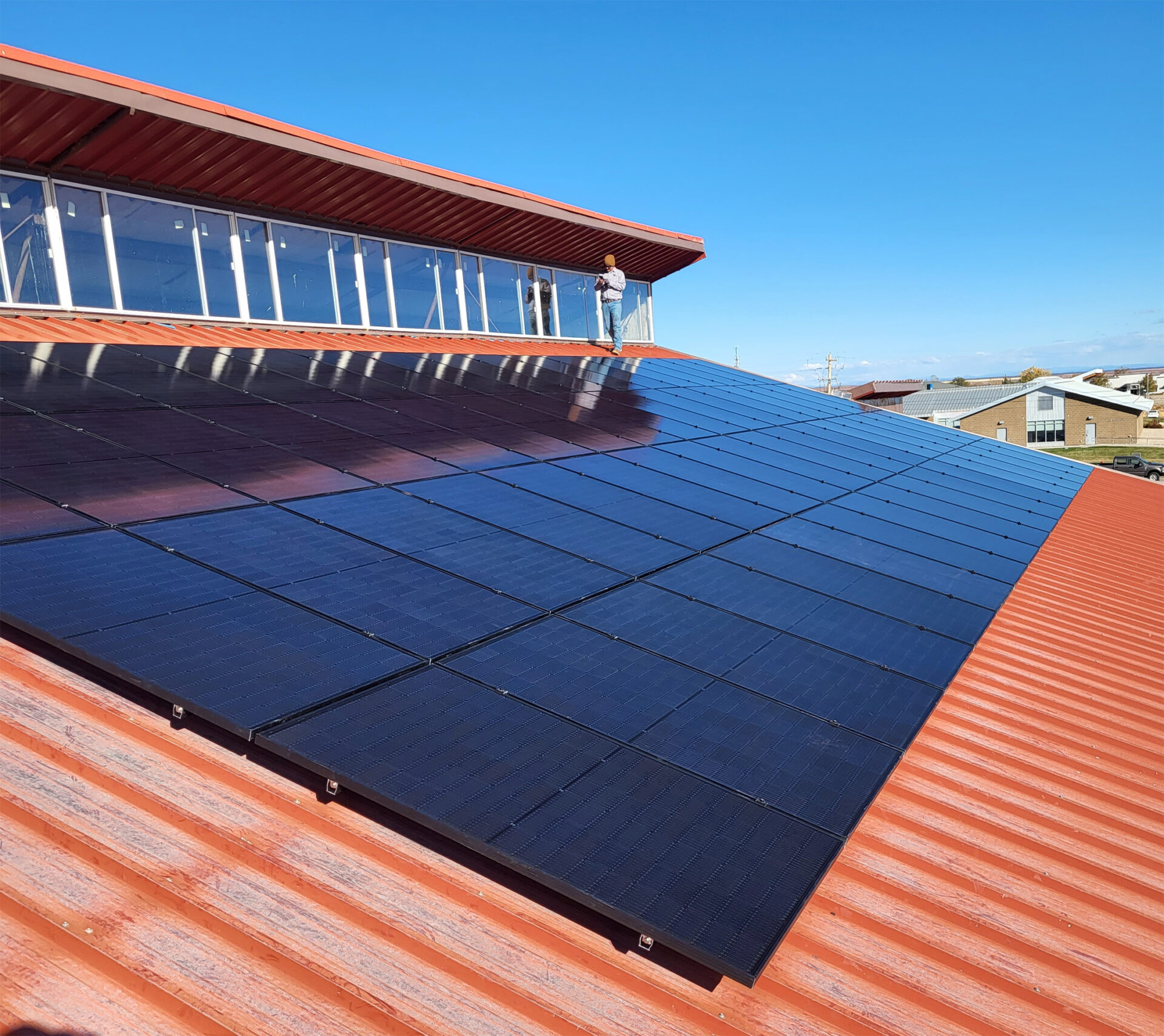 Angled view of solar panels on a red roof